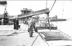 Amble - loading grain, NER and Broomhill staiths in distance, 1960s