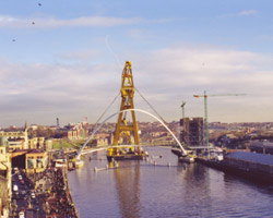 Arrival of Gateshead Millennium Bridge with heavy lift crane